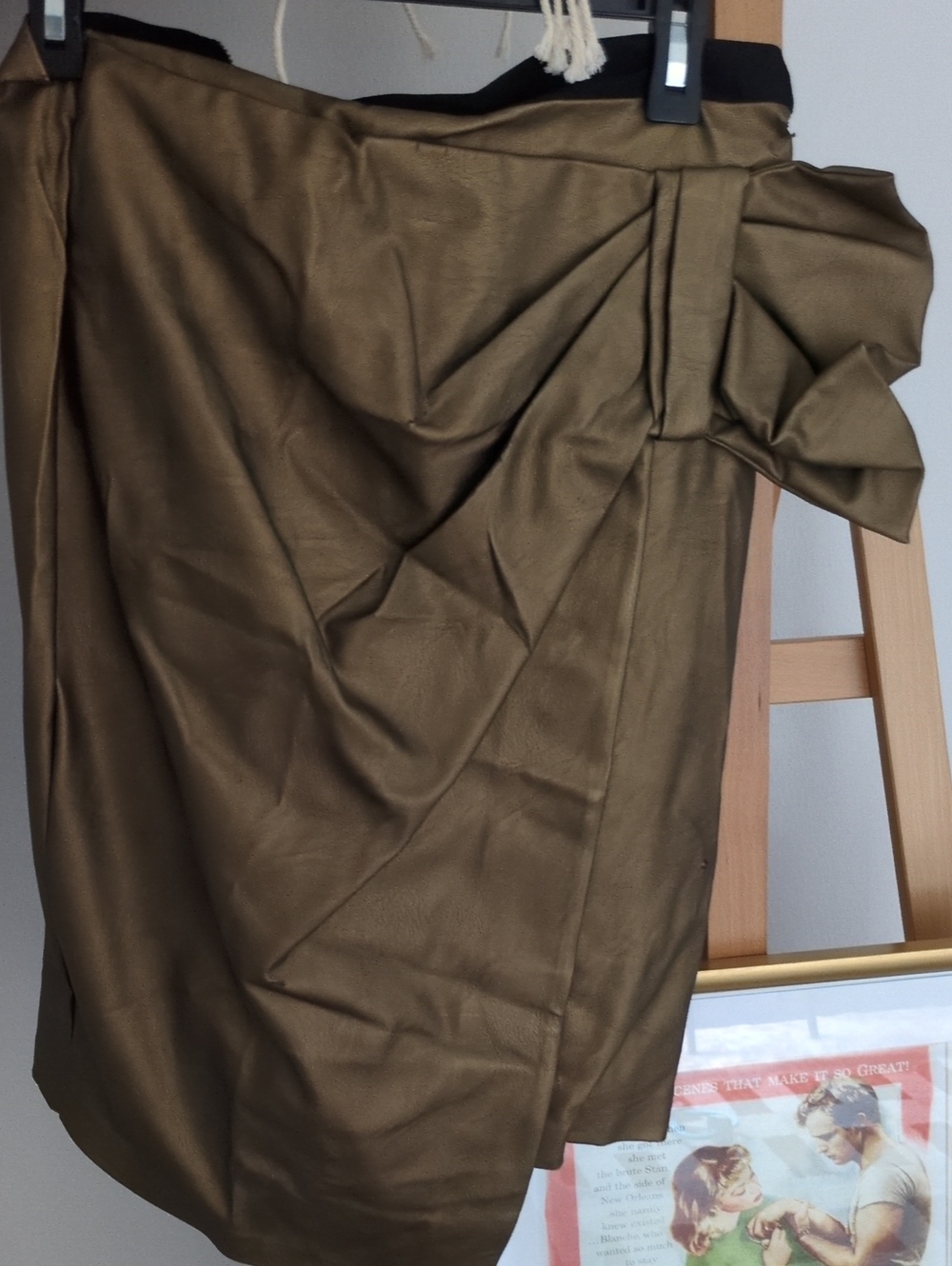 Bronze metallic twist midi skirt features a distinctive draped detail